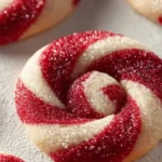 Plate of freshly baked candy cane cookies decorated with red and white stripes