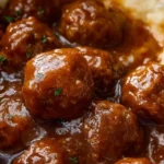 A delicious plate of slow cooker Salisbury steak meatballs served with gravy.