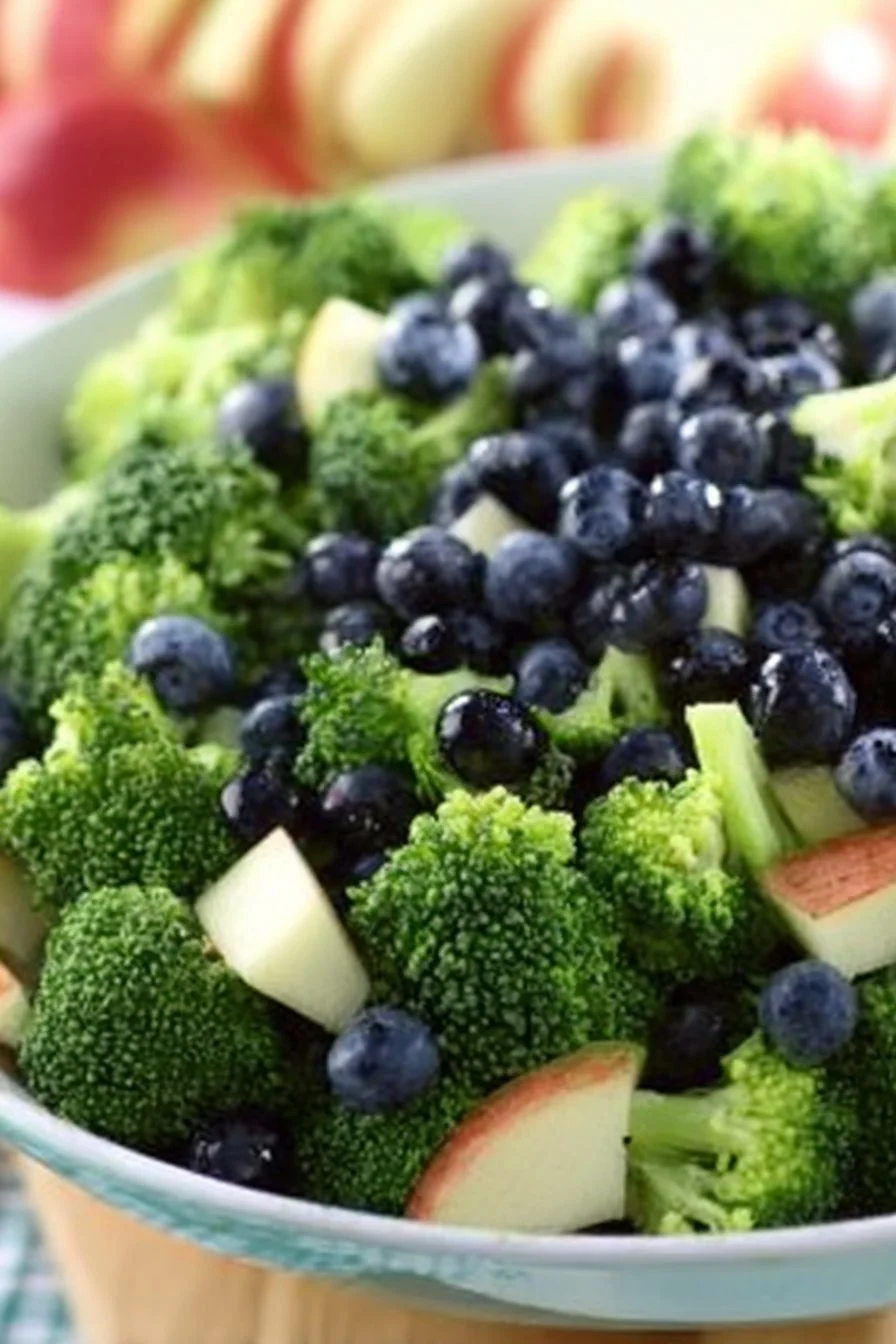 Skinny broccoli salad topped with poppy seed dressing in a bowl