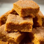Deliciously baked sugar cookie vegan pumpkin bars with pumpkin spice topping.