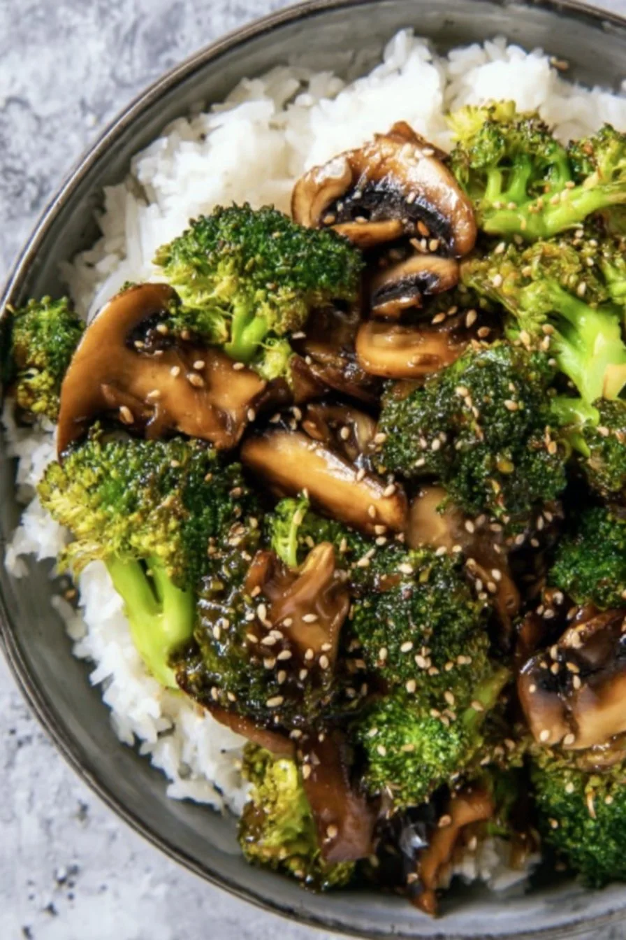Vegan broccoli and mushroom stir fry served in a colorful bowl.
