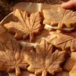 Vegan Maple Cookies on a plate with a drizzle of maple syrup
