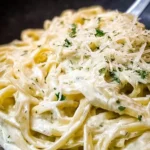 Delicious plate of Alfredo Linguine with creamy sauce and fresh herbs