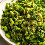 Chili Crisp Snap Pea Salad with fresh ingredients and a spicy chili dressing.