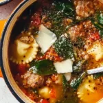 Bowl of delicious Italian Sausage Soup with fresh herbs and vegetables