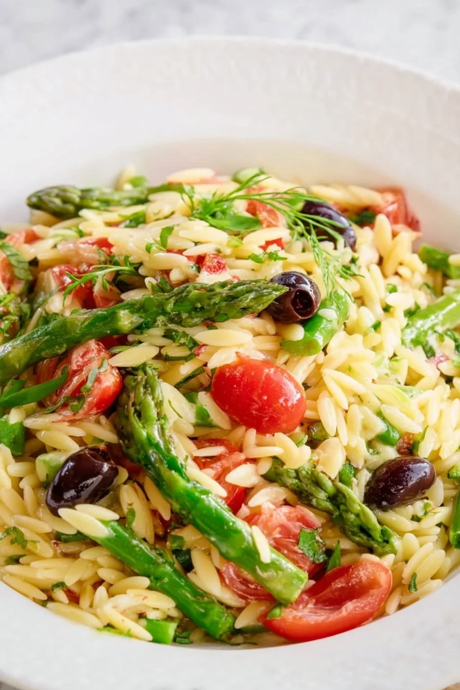 Shrimp Asparagus Orzo Pasta Salad with fresh ingredients in a bowl