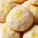 Freshly baked Lemon Ricotta Cookies on a plate, perfect for lemon lovers.