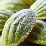 Plate of soft and fluffy Matcha Madeleines with a vibrant green hue